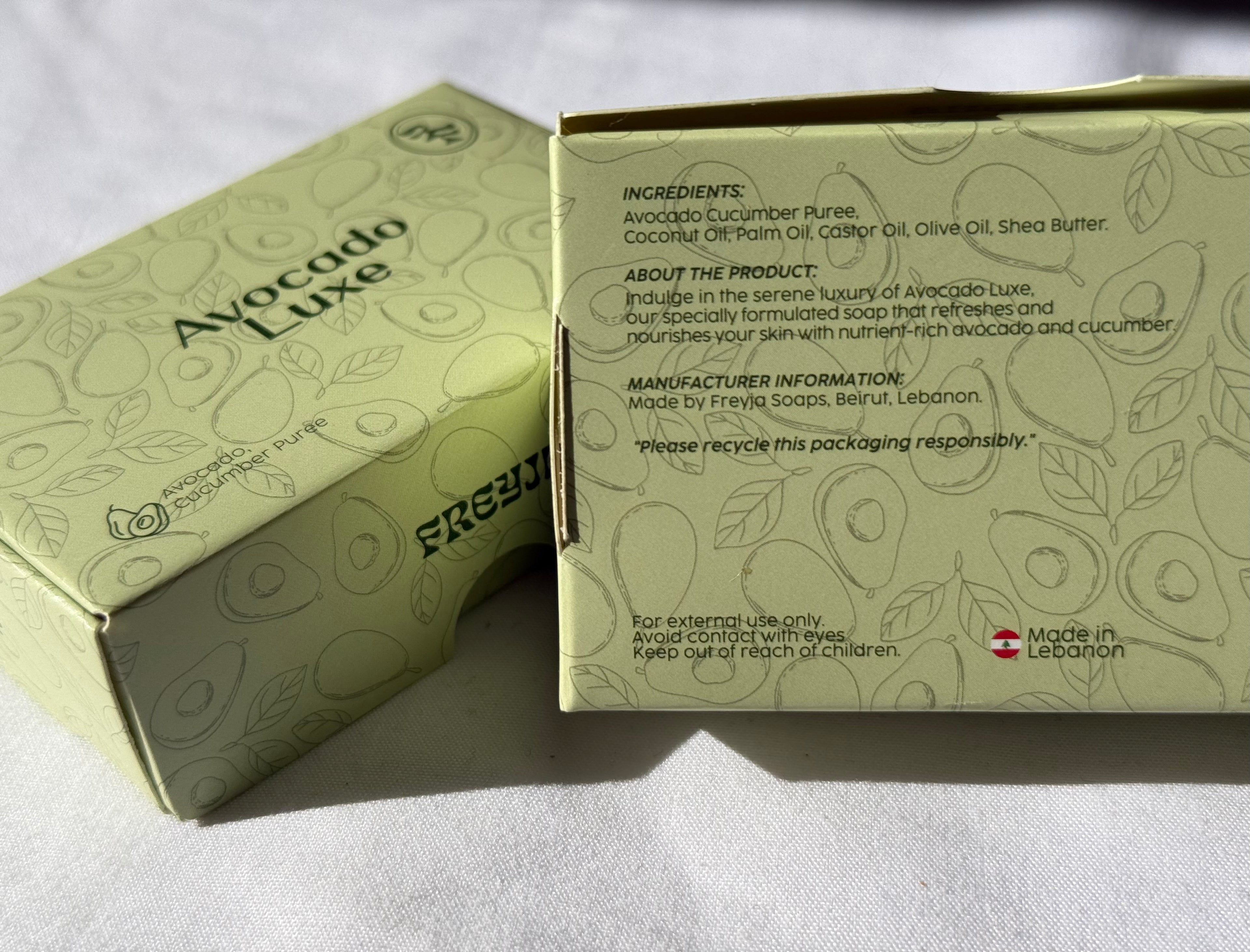 Avocado Luxe product packaging with ingredients list on a white background