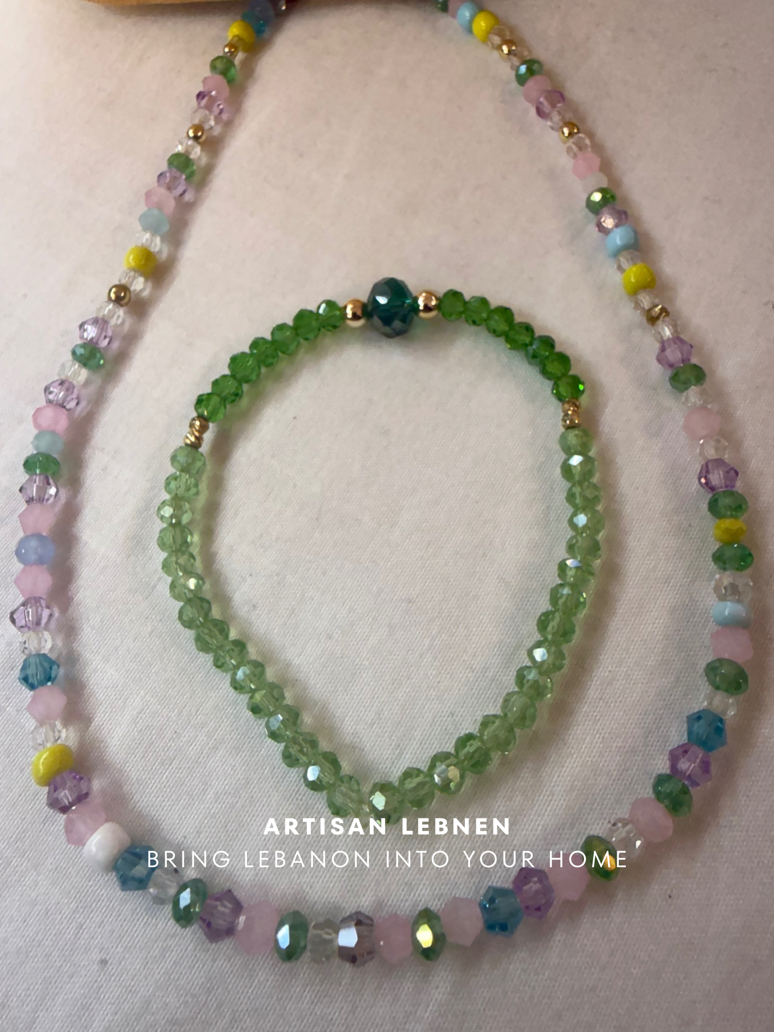 Set of beaded necklaces on a light background with 'Artisan Lebnen' branding.