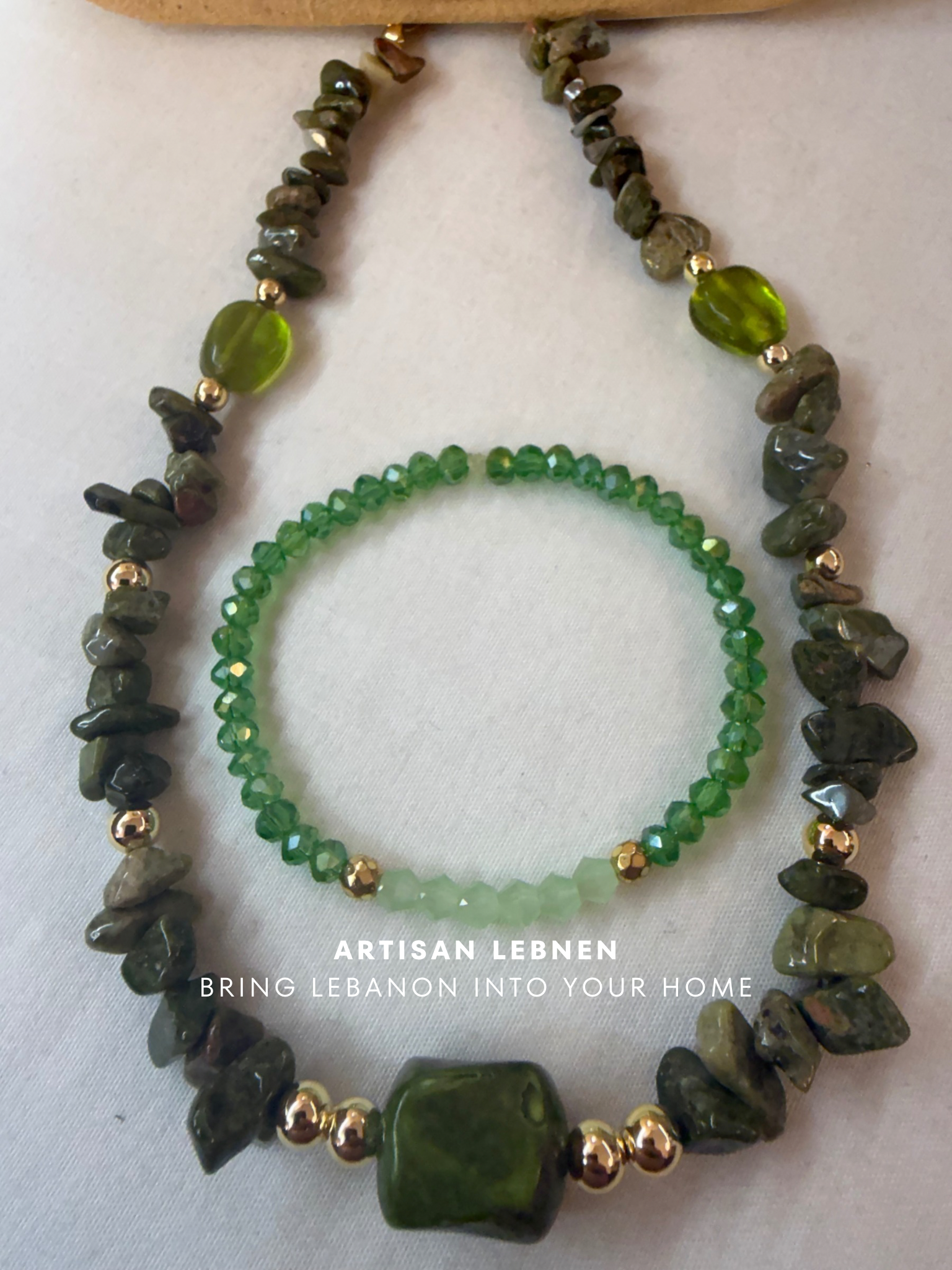 Green beaded necklace and bracelet set on a white background with 'Artisan Lebnen' branding.
