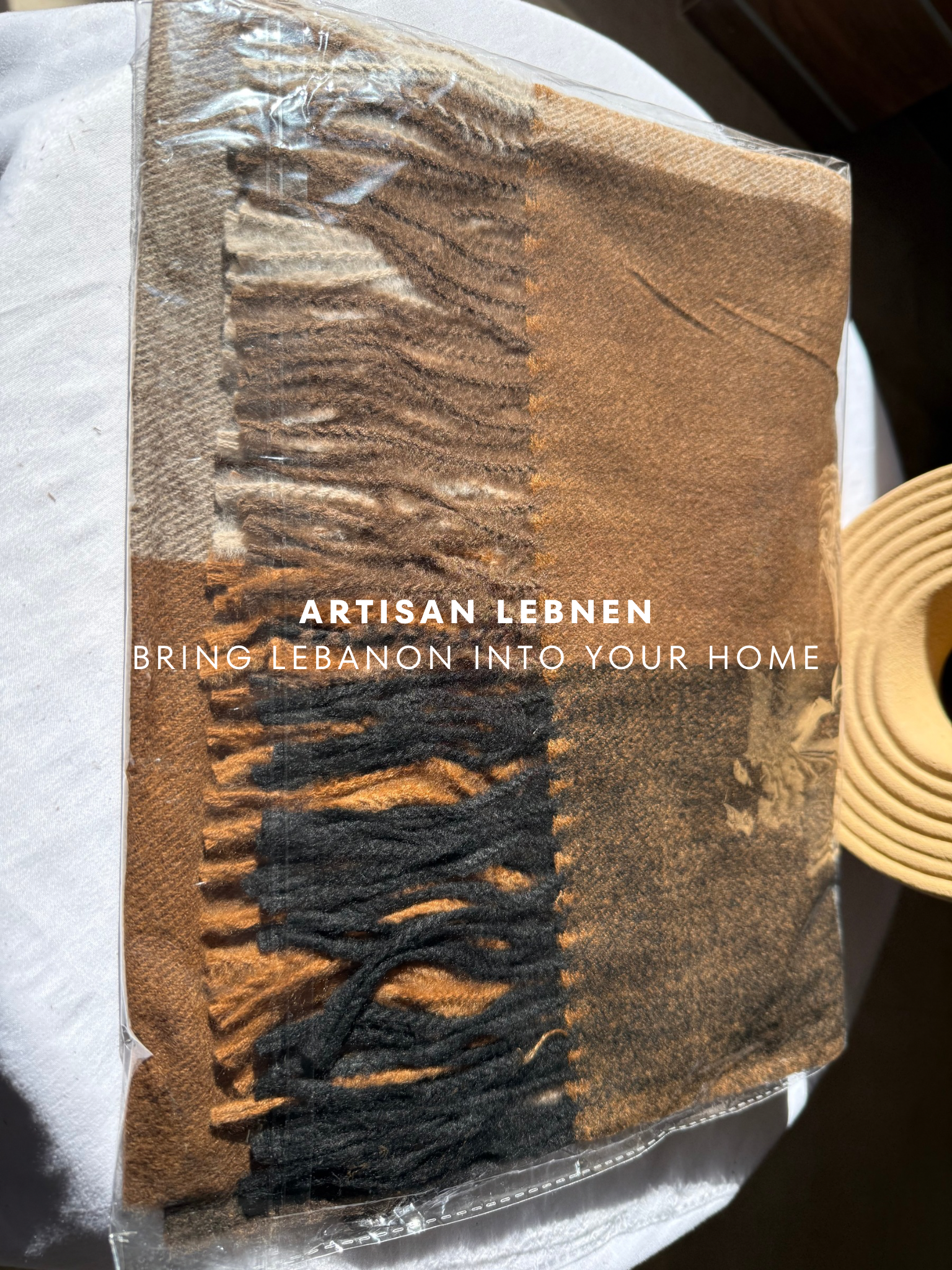 Brown textured product with 'Artisan Lebnen' branding on a white surface.