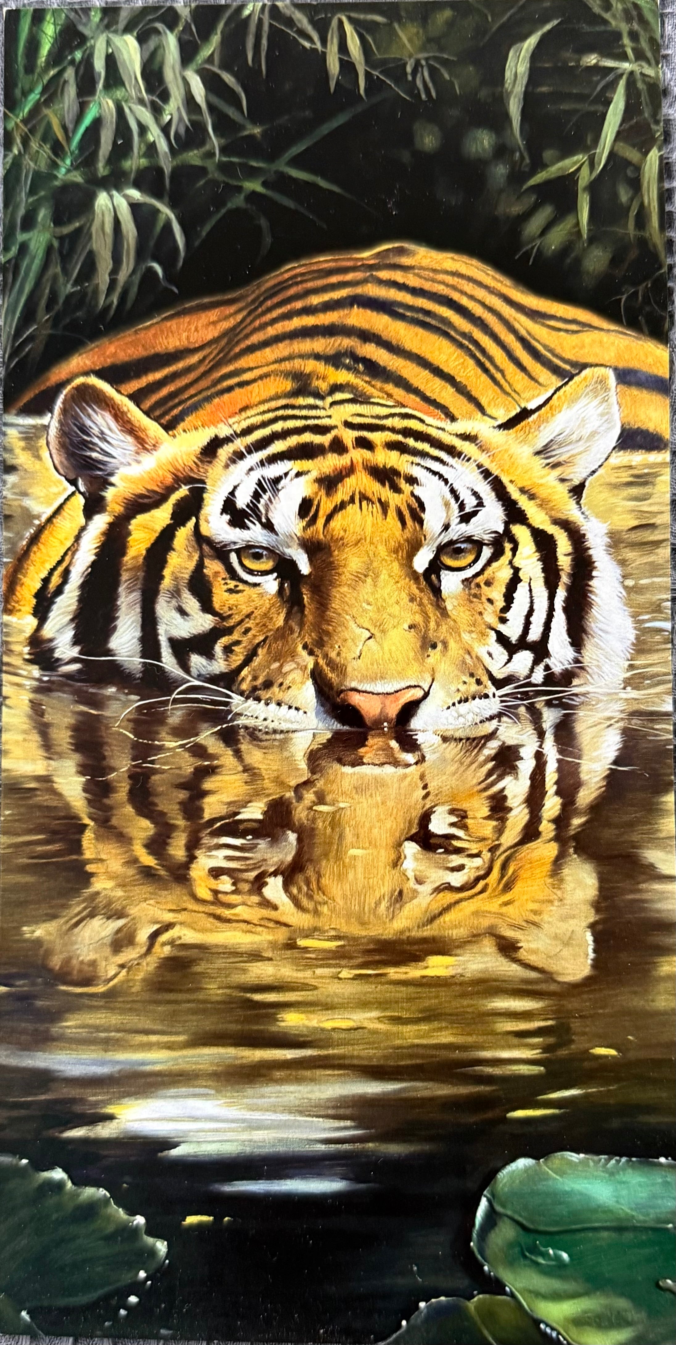 Tiger reflection in water with foliage